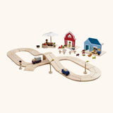 PlanToys wooden road pieces with vehicles next to a home, farm and market stall set