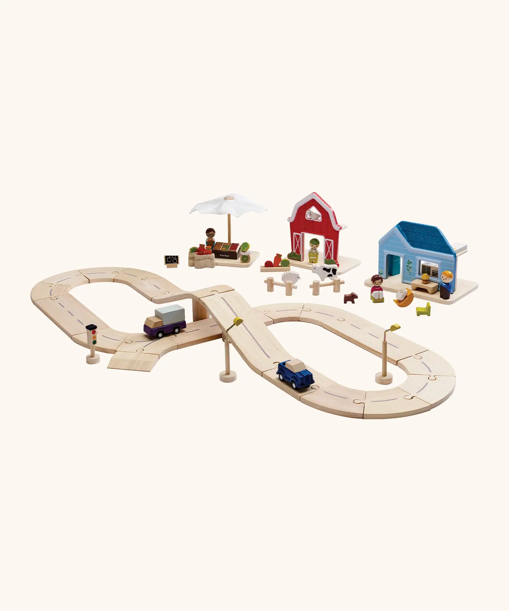 PlanToys wooden road pieces with vehicles next to a home, farm and market stall set