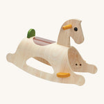 PlanToys Palomino Rocking Horse - Modern Rustic is a beautiful first rocking horse for any child. This rocking horse is in natural wood showing the wood-grain, with yellow handles and foot plates, a brown seat patch on the back of the horse, and a green back rest. The image is on a cream background
