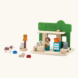 Back of the PlanToys wooden pet shop showing the different animal and shop keeper figures and other accessories 