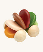 PlanToys Pastel Car is a fun, push and pull, sensory wooden car which is perfect for babies and toddlers. When pushed along the ground, the pastel coloured pieces (in orange, beige, brown, burgundy and green) in the middle create a soft clacking sound. The image is on a cream background