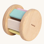 The PlanToys Pastel Roller, is a fun push and pull roller toy for babies and little ones. The roller comes with two natural wooden sides, with pastel coloured slats. The image is on a cream background