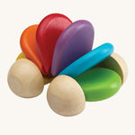 The PlanToys Car Rattle is a fun, push and pull, sensory wooden car which is perfect for babies and toddlers. When pushed along the ground, the bright rainbow coloured pieces (in green, blue, purple, red, orange and yellow) in the middle create a soft clacking sound. The image is on a cream background