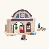PlanToys wooden train station. A add on expansion set for a PlanToys rail set. Features wooden people figures, trolleys and bikes
