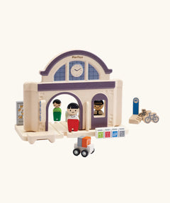 PlanToys wooden train station. A add on expansion set for a PlanToys rail set. Features wooden people figures, trolleys and bikes
