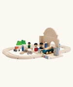 A railroad setup using PlanToys rail pieces and a train station