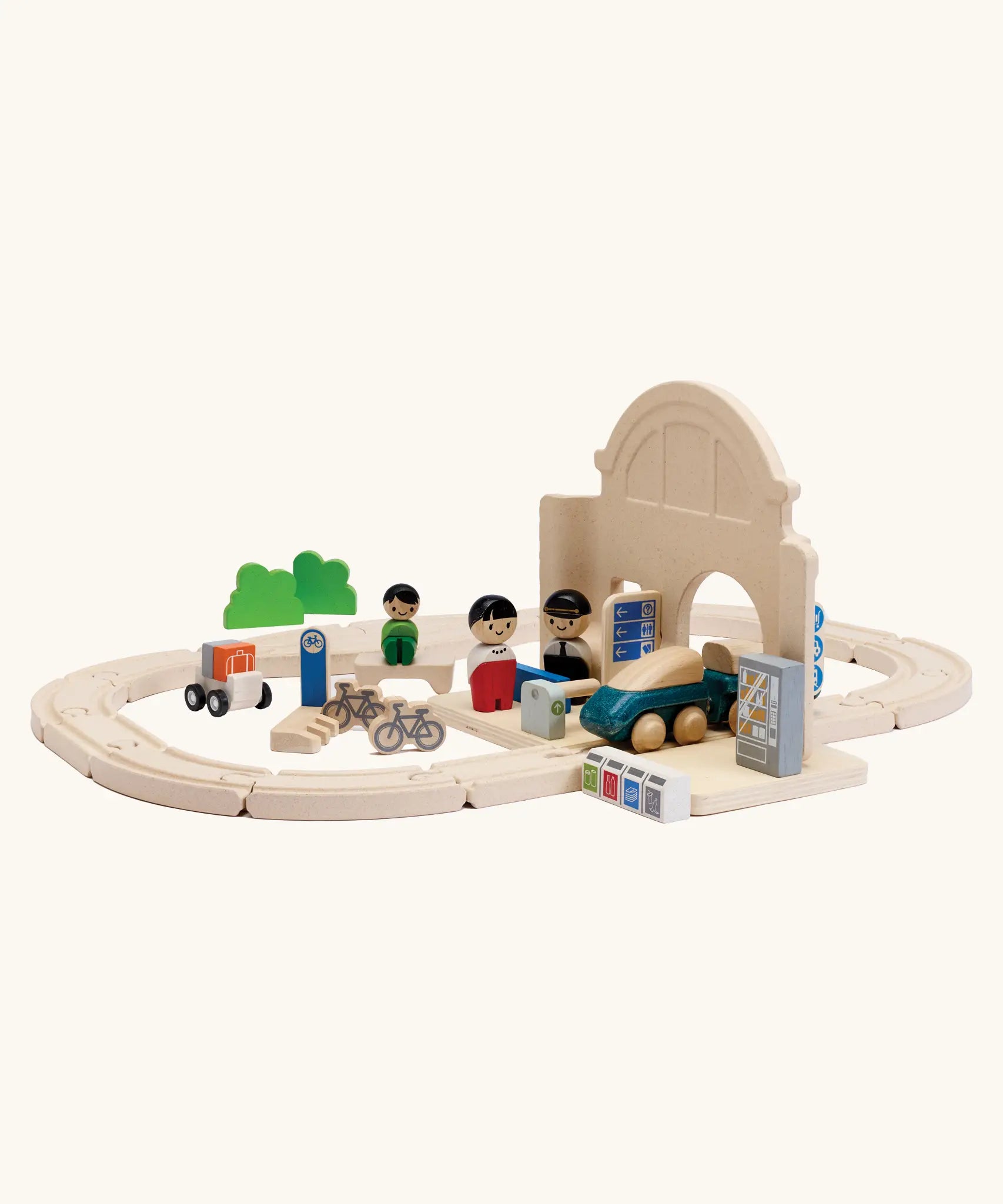 A railroad setup using PlanToys rail pieces and a train station