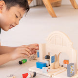 Back of a PlanToys wooden train station expansion set