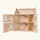 PlanToys wooden Victorian dolls house. with the front of the top and bottom floor open showing the staircase
