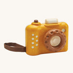 This PlanToys classic wooden toy is perfect for little ones and is in a mustard yellow colour with brown accents. The kaleidoscope in the lens can be rotated making multiple images that spin around. The pretend shutter button on the top can be pressed and there's a handy wrist strap just like the real thing. The image is on a cream background