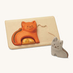 PlanToys Cat Puzzle is an adorable toy that comes with three cats, one grey, one orange and one yellow. Made from PlanWood, and with a light coloured puzzle board. This image is on a cream background