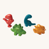 PlanToys Dino Set has 4 adorable dinosaurs. One in red, blue, green and yellow, all made to look like a mini dinosaur. The image is on a cream background