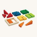 PlanToys children's wooden fraction blocks maths learning set laid out on a cream background. The block colours are red, blue, dark green, light green, yellow, and orange