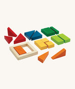 PlanToys children's wooden fraction blocks maths learning set laid out on a cream background. The block colours are red, blue, dark green, light green, yellow, and orange