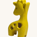 The PlanToys Giraffe is an adorable wild animal toy for little ones. Made from PlanWood, this giraffe is yellow with textured brown patches, and is on a cream background
