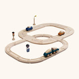 PlanToys my first rail & road playset. showing wooden vehicles on the road and a train on the rail