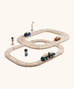 PlanToys my first rail & road playset. showing wooden vehicles on the road and a train on the rail