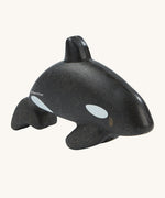 The PlanToys Orca is an adorable sea life toy for little ones. Made from PlanWood, this orca is black with white spots, and is on a cream background
