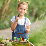 Child holding a loose veg piece with a PlanToys seedling patch on a large planter