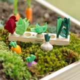 PlanToys wooden seedling patch planter with loose wooden veg pieces