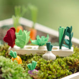 PlanToys seedling patch showing loose wooden veg pieces scaattered around a planter