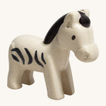 The PlanToys Zebra is an adorable wild animal toy for little ones. Made from PlanWood, this zebra is white with black stripes, a black mane and eyes , and is on a cream background