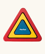 overhead view of the PlanToys nesting triangle wooden toy. 