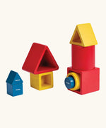 Three PlanToys nesting wooden toy sets, triangle, boxes and cylinders.