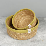 Respiin set of 2 natural shallow seagrass jute baskets with green rim with the small basket stacked on top of the medium basket