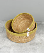 Respiin set of 2 natural shallow seagrass jute baskets with green rim with the small basket stacked on top of the medium basket