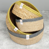 Respiin set of 2 natural shallow seagrass jute baskets with green rim with stacked on top of the grey rimmed baskets