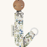 Avery Row Pacifier Holder - River Bank, showing the silicone ring and wooden clip