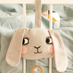 Roommate Musical Baby Mobile - Bunny on the side of a white baby cot