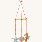 Roommate Sealife Hanging Mobile. A lovely nautical themed hanging mobile with a sleepy blue starfish, pink shell, and mustard yellow seahorse