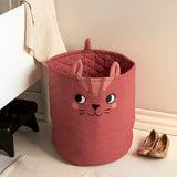 Large Roommate organic cotton storage cat basket in red standing in a bedroom 