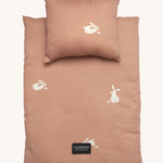 Roommate Doll Bedding Set - Rabbit in a pale pink colour with adorable rabbit print. The image shows a blanket and a pillow, on a cream background