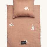 Roommate Doll Bedding Set - Rabbit in a pale pink colour with adorable rabbit print. The image shows a blanket and a pillow, on a cream background