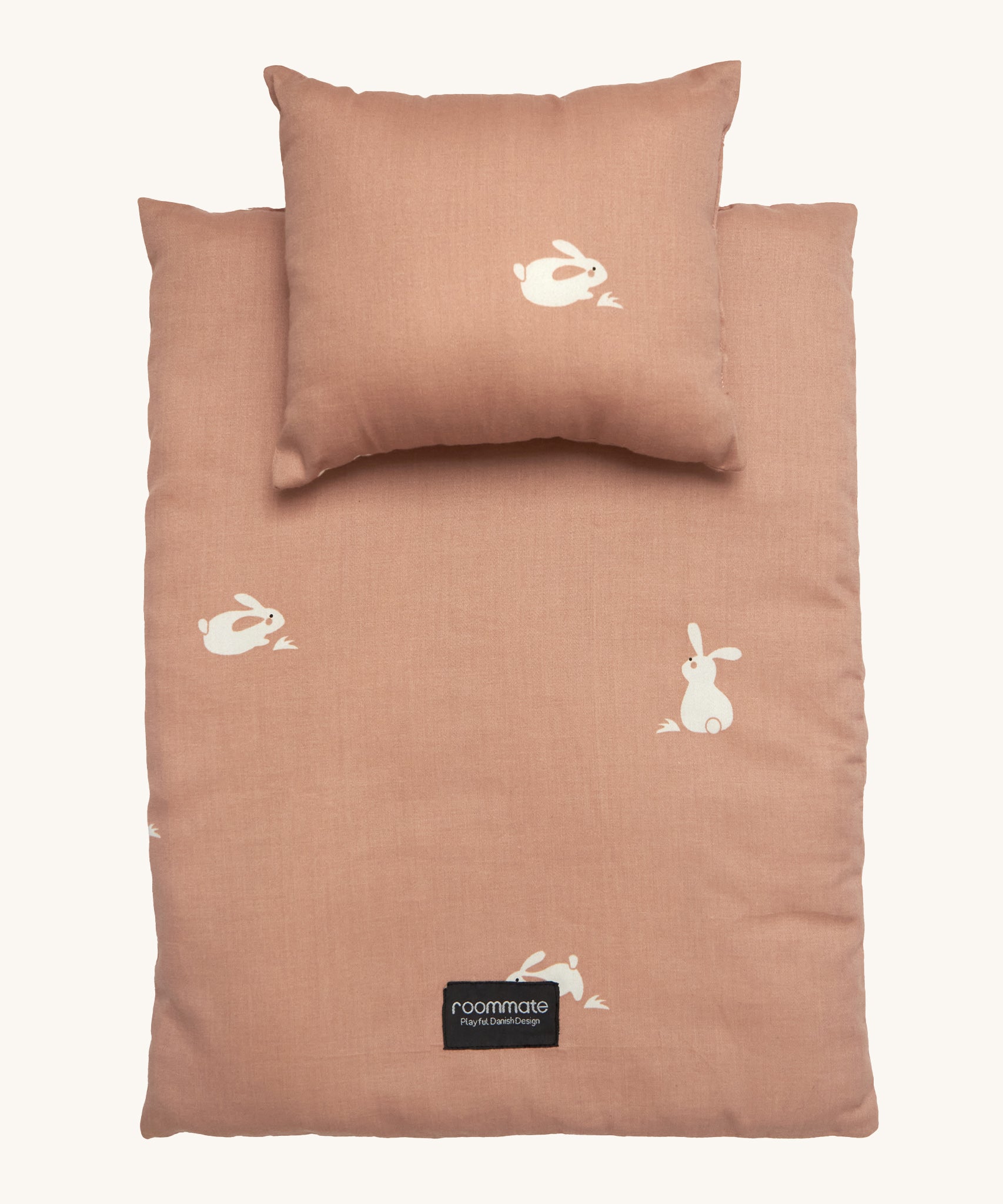 Roommate Doll Bedding Set - Rabbit in a pale pink colour with adorable rabbit print. The image shows a blanket and a pillow, on a cream background