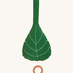 Roommate Leaf Lullaby Music Mobile, on a cream background. The leaf mobile has embroidered leaf veins and a wooden pull cord hoop