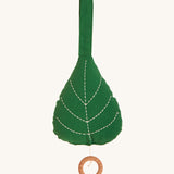 Roommate Leaf Lullaby Music Mobile, on a cream background. The leaf mobile has embroidered leaf veins and a wooden pull cord hoop