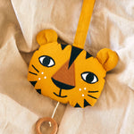 The Roommate Tiger Music Mobile laid on a beige blanket