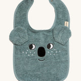 Roommate Organic Cotton Baby Bib - Koala is a soft flannel baby bib with a koala face, interactive koala ears, and metal popper fasteners to close the bib at the back of the neck. The image is on a cream background
