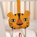 The Roommate Tiger Music Mobile attached to the side of a white crib