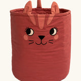 Roommate organic cotton storage basket in red with playful cat facial features and ears. Inside has a quilted finish