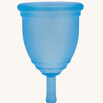 Ruby Cup Menstrual Cup in blue silicone, on a cream background