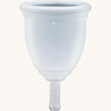 Ruby Cup Menstrual Cup in clear silicone, on a cream background
