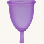 Ruby Cup Menstrual Cup in purple silicone, on a cream background