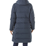 Person wearing a long blue puffer coat on a white background