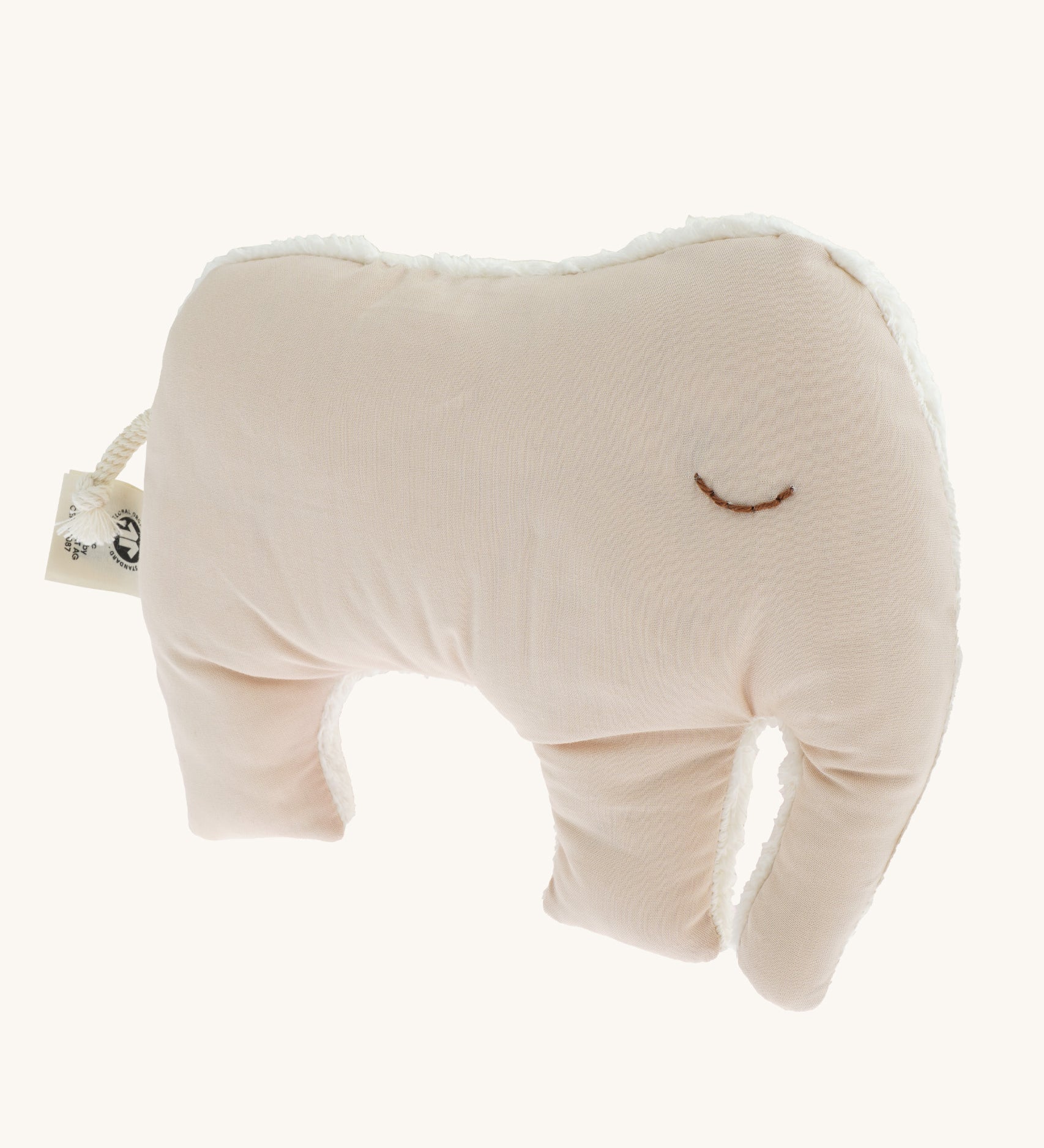 The cream coloured cotton fabric side of the Senger Cuddly Animal Cushion - Elephant, with the other side as a white fluffy fabric. 