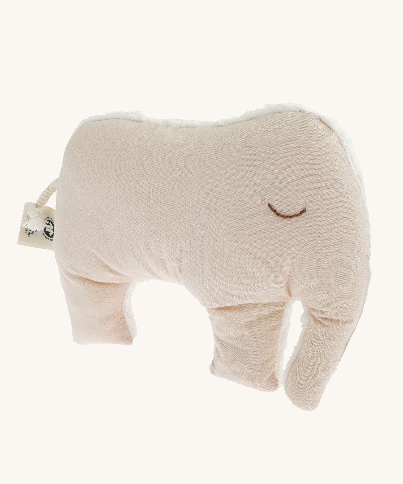 The cream coloured cotton fabric side of the Senger Cuddly Animal Cushion - Elephant, with the other side as a white fluffy fabric. 